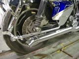 Modified exhaust tips into turndowns, eliminating the rear exhaust openings in the fender and bags.